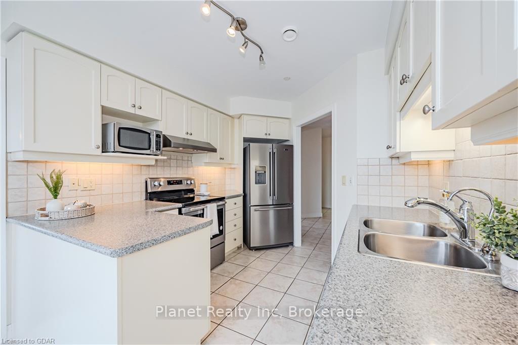 Photo 12 of Unit 407, 65 Bayberry Drive, Guelph, Village By The Arboretum — HOMEH