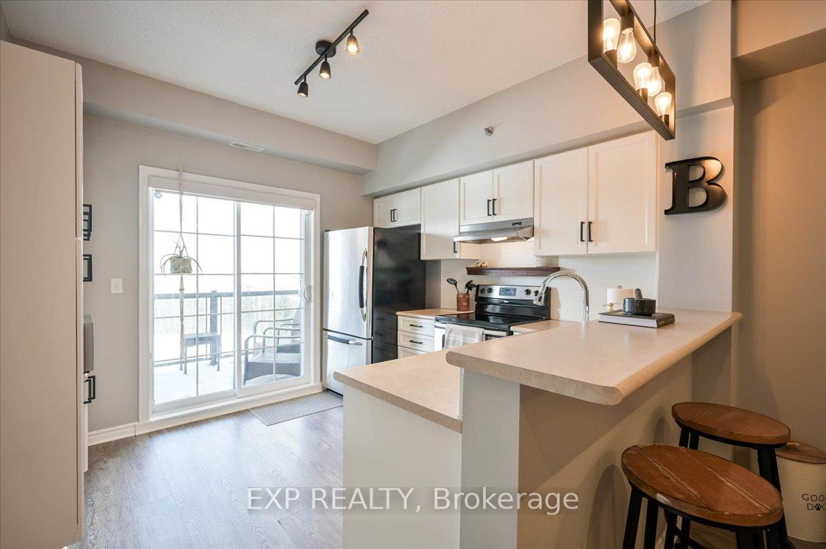 Photo 7 of Unit 407, 308 Watson Parkway N, Guelph, Grange Road — HOMEH