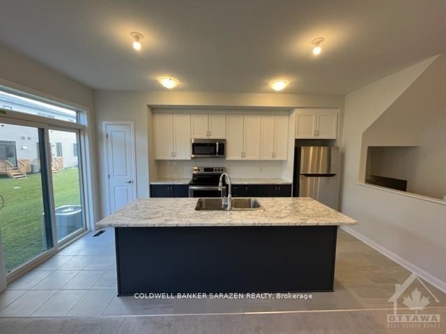 Photo 4 of 561 Aglish Mews, Ottawa, Barrhaven - Half Moon Bay — HOMEH