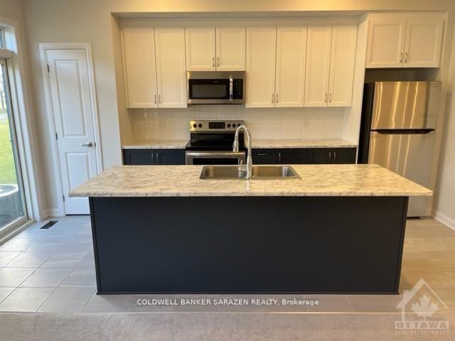 Photo 6 of 561 Aglish Mews, Ottawa, Barrhaven - Half Moon Bay — HOMEH