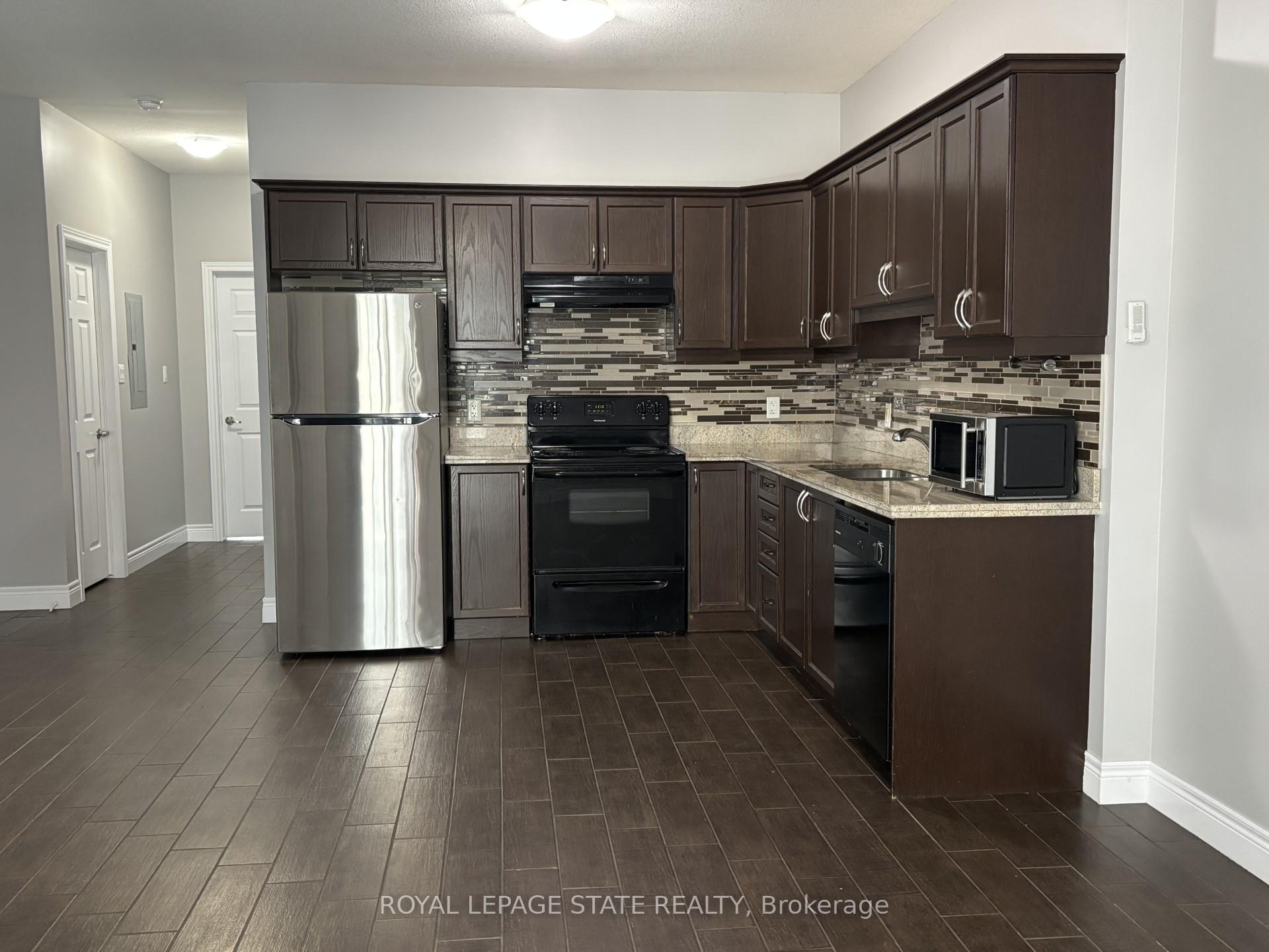 Photo 2 of Unit 2, 136 King Street W, Hamilton, Stoney Creek — HOMEH