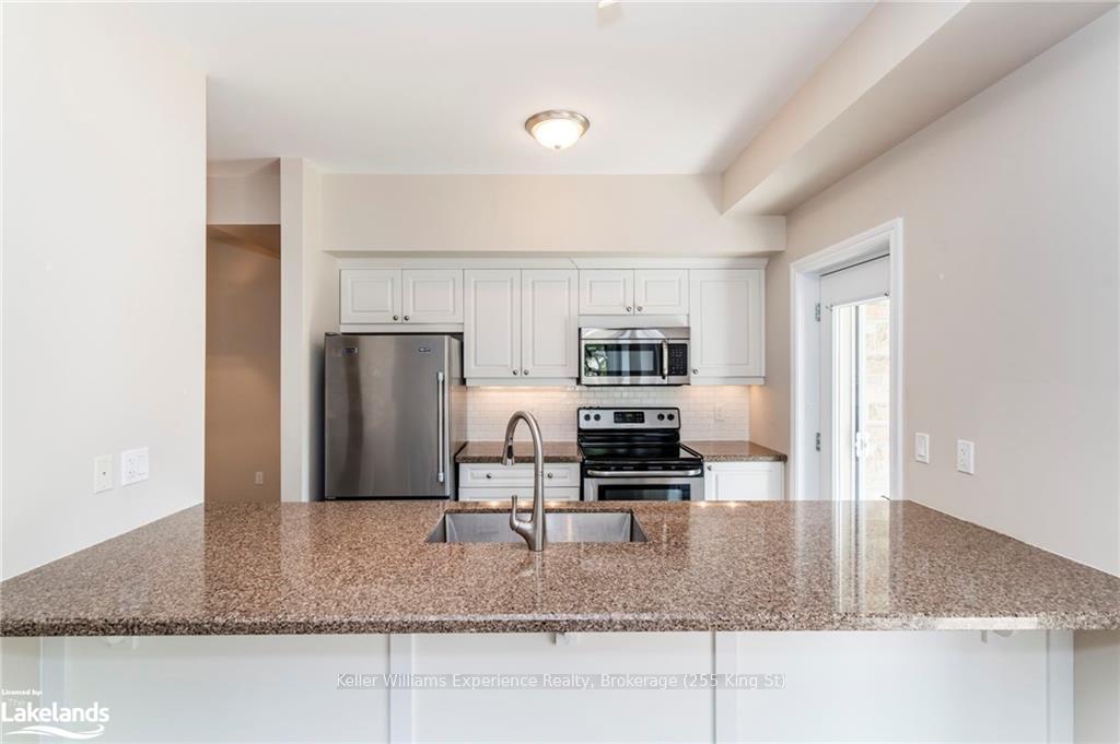 Photo 9 of Unit 105, 19A Yonge Street N, Springwater, Elmvale — HOMEH
