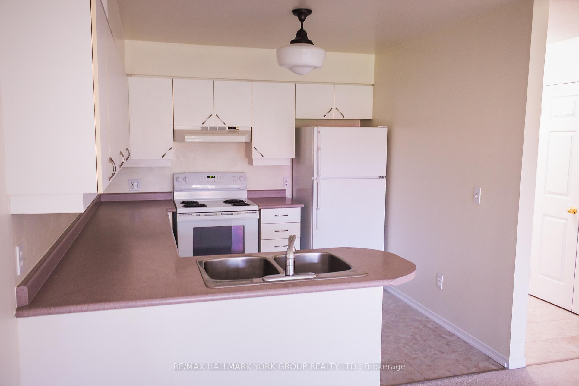Photo 4 of Unit 408, 143 Edgehill Drive, Barrie, Letitia Heights — HOMEH